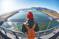 Cheerful woman walks on the brige in Jokulsarlon Ice Lagoon Royalty Free Stock Photo