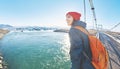 Cheerful woman walks on the brige in Jokulsarlon Ice Lagoon Royalty Free Stock Photo