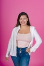 Cheerful woman in white shirt, pink background. Royalty Free Stock Photo