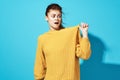 cheerful woman in yellow sweater studio posing fashion positive