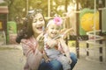 Cheerful woman blows soap bubbles with her child Royalty Free Stock Photo