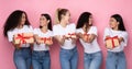 Cheerful Women Holding Wrapped Gifts Standing Over Pink Background, Panorama Royalty Free Stock Photo