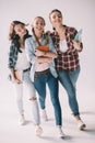 Cheerful women students walking with textbooks in hands Royalty Free Stock Photo