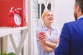 Cheerful work of two people during break time in bright office. Business team having coffee break, discussion talking at Royalty Free Stock Photo