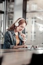 Positive young woman looking at her notes and smiling Royalty Free Stock Photo