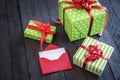Cheerful wrapped presents and opened letter Royalty Free Stock Photo