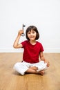 Cheerful kid showing key for success, creativity and inspiring career Royalty Free Stock Photo