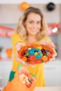 cheerful young adult mother preparing to halloween event