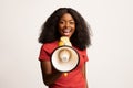 Cheerful Young African American Female Making Announcement With Loudspeaker Royalty Free Stock Photo