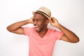 Cheerful young african american man laughing with hat against white background Royalty Free Stock Photo