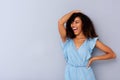 Cheerful young african american woman laughing against gray background Royalty Free Stock Photo