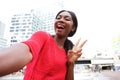 Cheerful young african american woman taking selfie in the city Royalty Free Stock Photo