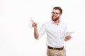 Cheerful young bearded man using tablet computer. Royalty Free Stock Photo