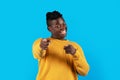 Cheerful Young Black Male Pointing Two Fingers At Camera And Saying Gotcha Royalty Free Stock Photo