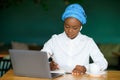 Cheerful young black woman attending online business meeting, cafe interior Royalty Free Stock Photo