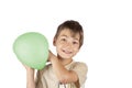 Cheerful young boy holding a green slime balloon. Royalty Free Stock Photo