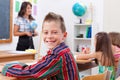 Cheerful young boy in school Royalty Free Stock Photo
