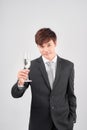 Cheerful Young Business Man Raising Glass of Wine