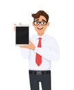 Cheerful young business man showing blank screen tablet. Trendy person holding digital tab. Male character design illustration. Royalty Free Stock Photo