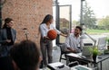 Cheerful young businesswoman having fun with ball in office, take a break concept. Royalty Free Stock Photo