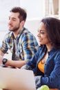 Cheerful young colleagues are working in team Royalty Free Stock Photo