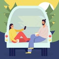 Cheerful young couple enjoy vacation sitting in rear of van, people in camper van, picnic in the forest