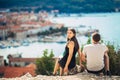 Cheerful young couple having a field trip date.Cityscape sightseeing,seaside travel vacation.Traveling in Europe Royalty Free Stock Photo