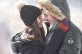 Cheerful young couple having fun in winter park Royalty Free Stock Photo