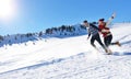 Cheerful young couple having fun in winter park Royalty Free Stock Photo