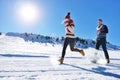 Cheerful young couple having fun in winter park Royalty Free Stock Photo