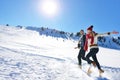 Cheerful young couple having fun in winter park Royalty Free Stock Photo