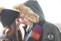 Cheerful young couple having fun in winter park Royalty Free Stock Photo