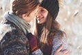 Cheerful young couple having fun in winter park Royalty Free Stock Photo