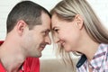 Cheerful young couple looking each other close up of eyes at home Royalty Free Stock Photo