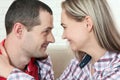 Cheerful young couple looking each other close up of eyes at home Royalty Free Stock Photo