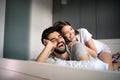 Cheerful young couple making massage at home Royalty Free Stock Photo