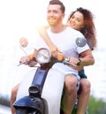 Happy cheerful couple riding vintage scooter. Travel concept. Royalty Free Stock Photo