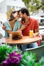 Cheerful young couple on a romantic date in a cafe. Royalty Free Stock Photo