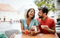 Cheerful young couple on a romantic date in a cafe. Royalty Free Stock Photo