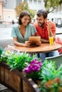 Cheerful young couple on a romantic date in a cafe. Royalty Free Stock Photo