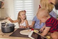 Family preparing meal together Royalty Free Stock Photo