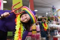 Cheerful young female joking in festival outfits store Royalty Free Stock Photo