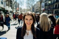 Cheerful young female tourist sightseeing in La Rambla street,Barcelona,Spain.Walking down the Barcelona`s famous shopping street Royalty Free Stock Photo