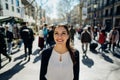 Cheerful young female tourist sightseeing in La Rambla street,Barcelona,Spain.Walking down the Barcelona`s famous shopping street Royalty Free Stock Photo