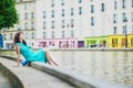 Cheerful young French woman having fun on Saint-Martin canal