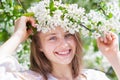 Girl enjoying springtime near blooming trees Royalty Free Stock Photo