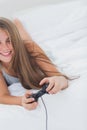 Cheerful young girl playing video games Royalty Free Stock Photo