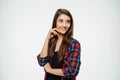 Cheerful young girl posing over white background looking aside