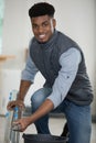 cheerful young handyman holding ladder Royalty Free Stock Photo
