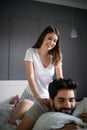 Cheerful young couple making massage at home Royalty Free Stock Photo